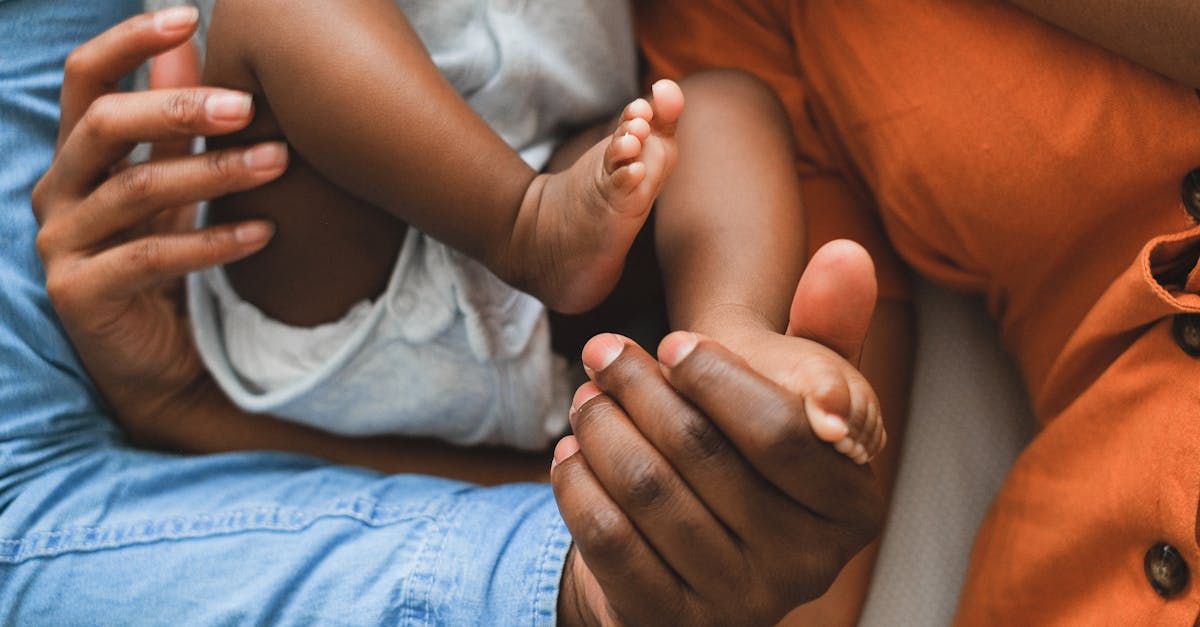 Close-up of a family holding a baby, showcasing love and connection.